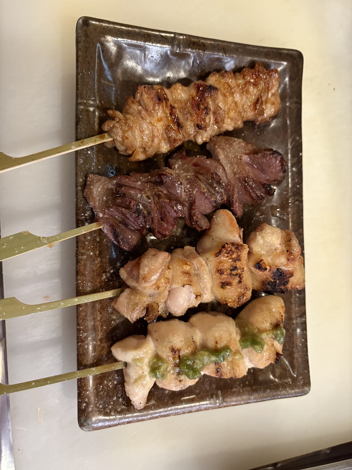 A plate of freshly grilled yakitori skewers